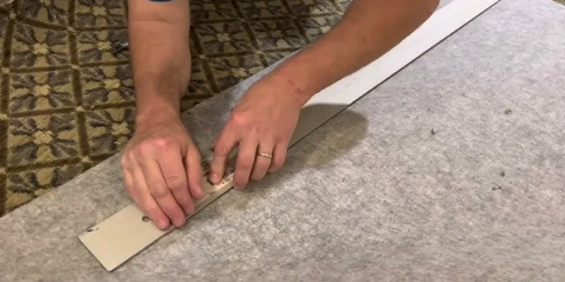 Wicker chair on blue rug